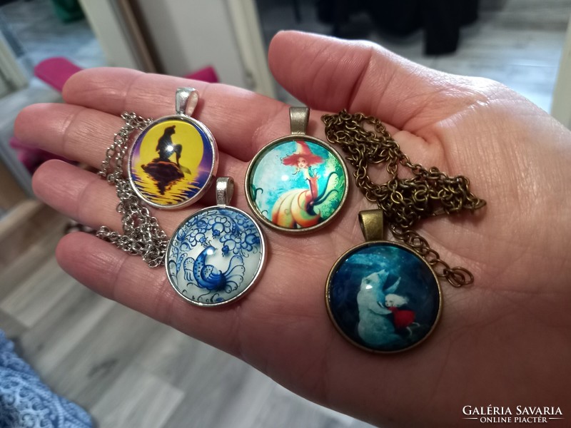 Bronze and silver-plated pendants, amulets with fairy-tale figures and glass lenses