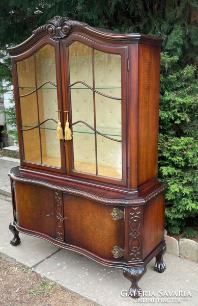 Wonderful baroque display case with curved lion legs with root veneer.