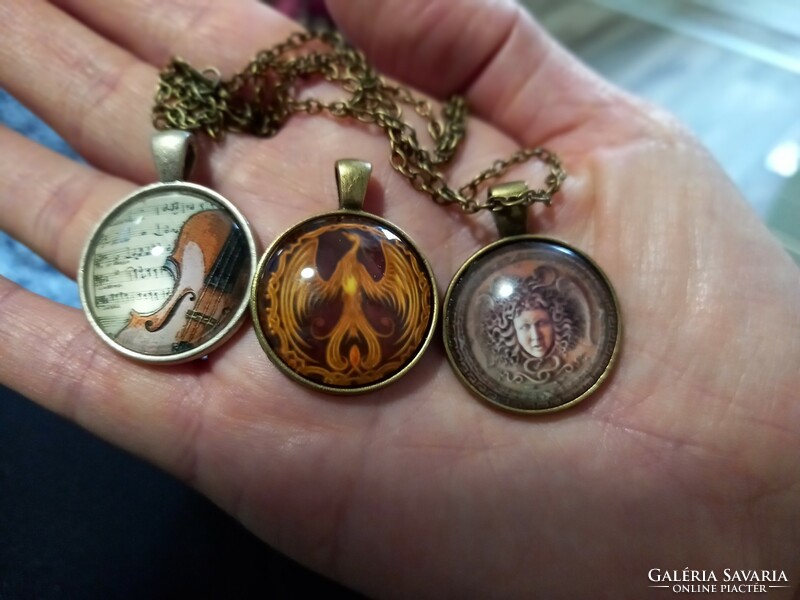 Bronze and silver-plated pendants, amulets with glass lenses