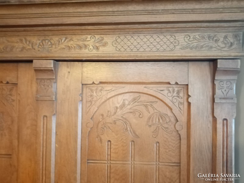 German carved tin cabinet