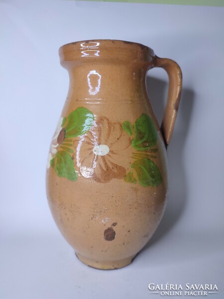 Old painted folk earthen pot with flowers
