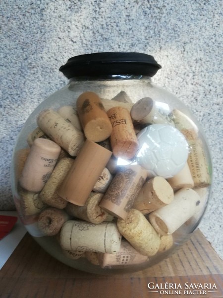 A large glass globe filled with corks