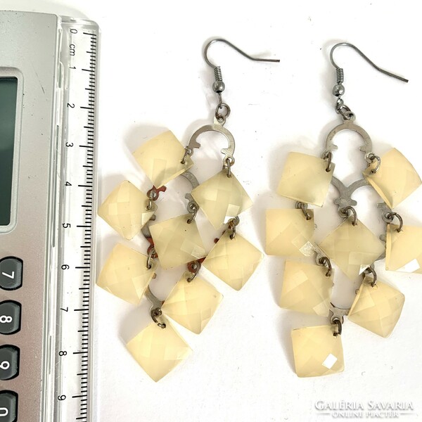 Long beige vintage earrings with hooks, the jewelry is from the 1980s