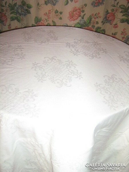 Beautiful white damask tablecloth with a baroque pattern