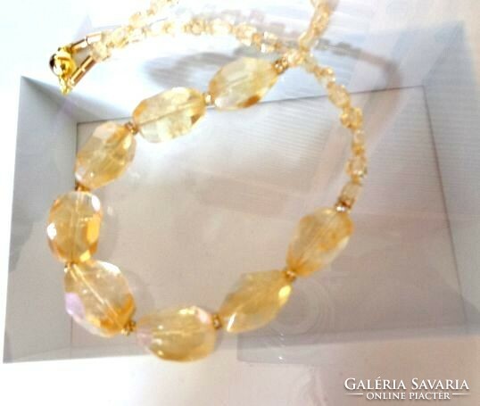 A natural mineral necklace made of large grains of citrine