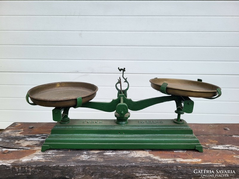 Marked force, two-arm cast iron 10-kilogram antique English scale with copper plates.