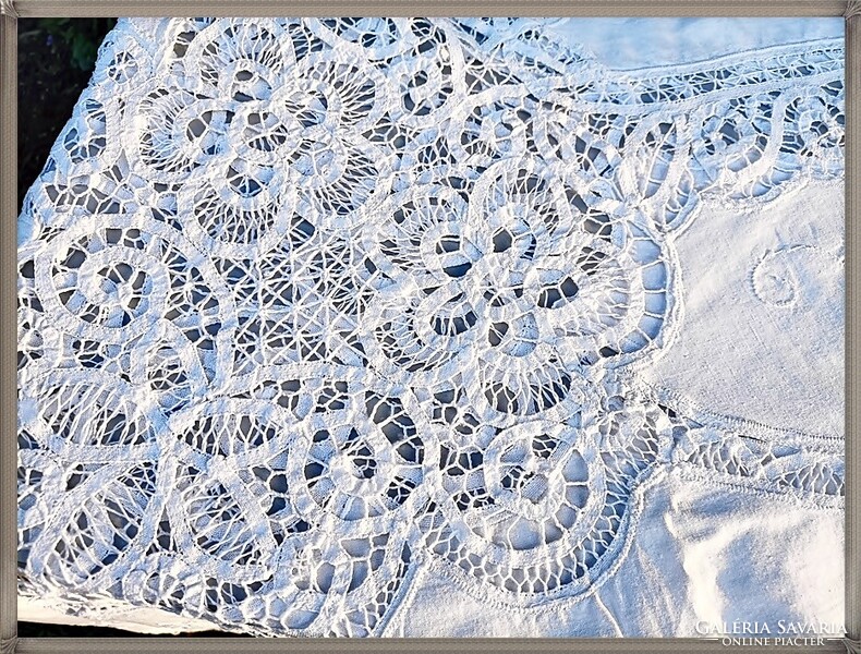 Huge, hand-embroidered, richly patterned, snow-white festive tablecloth