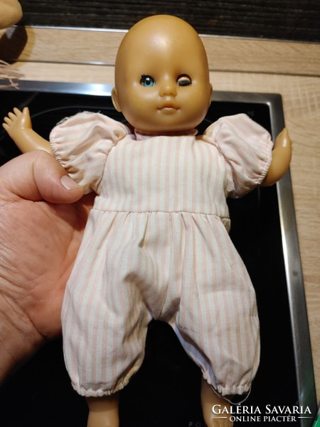 Bald blue-eyed blinking baby toy figure