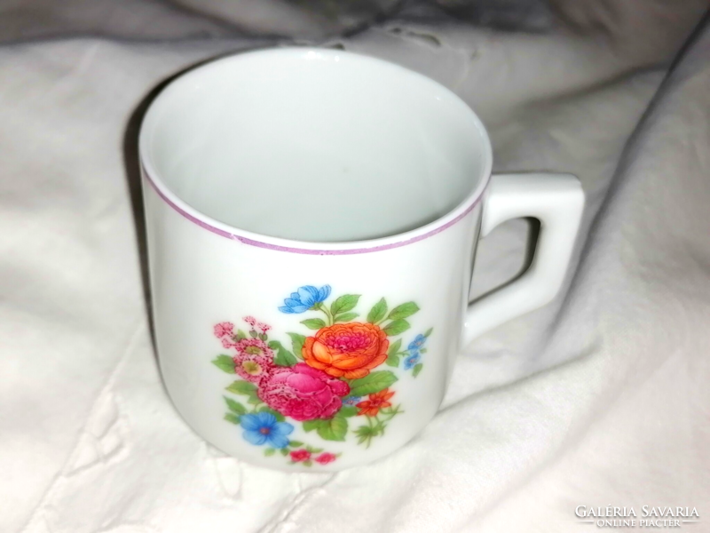 A rare Zsolnay coffee cup with a bouquet of spring flowers