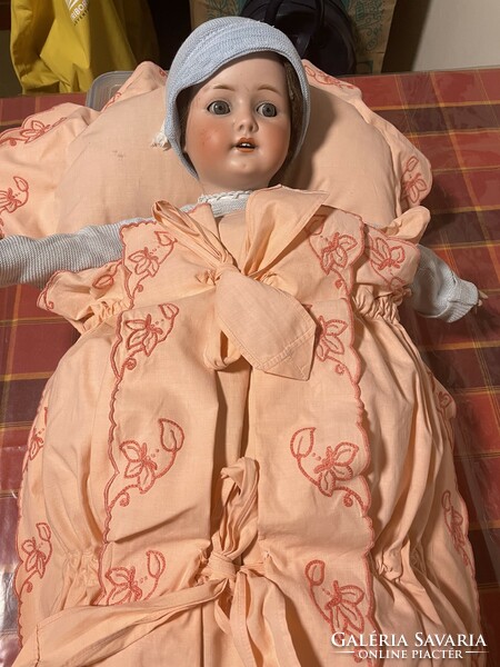 An old doll with a porcelain head