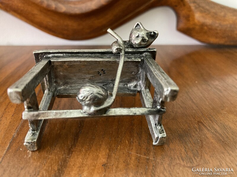 Silver-plated metal figure / statue of a playing cat