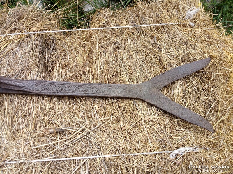 Old wrought iron hay cutter, decorated