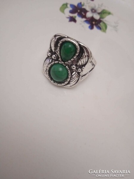 Old bijou ring with green stones.