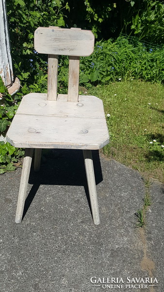 Old, rustic peasant chair, milking chair.