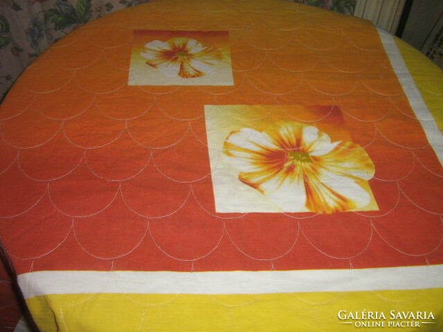A beautiful bedspread quilted with a huge floral pattern fleece