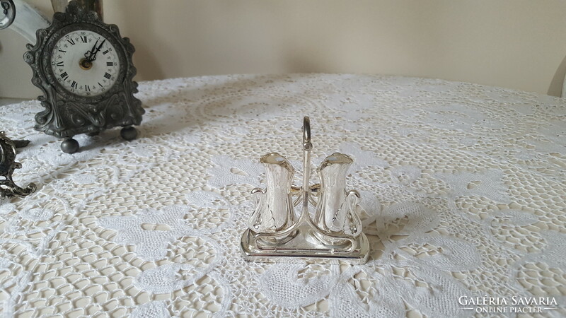 Beautiful silver-plated table salt and pepper shaker with bow holder