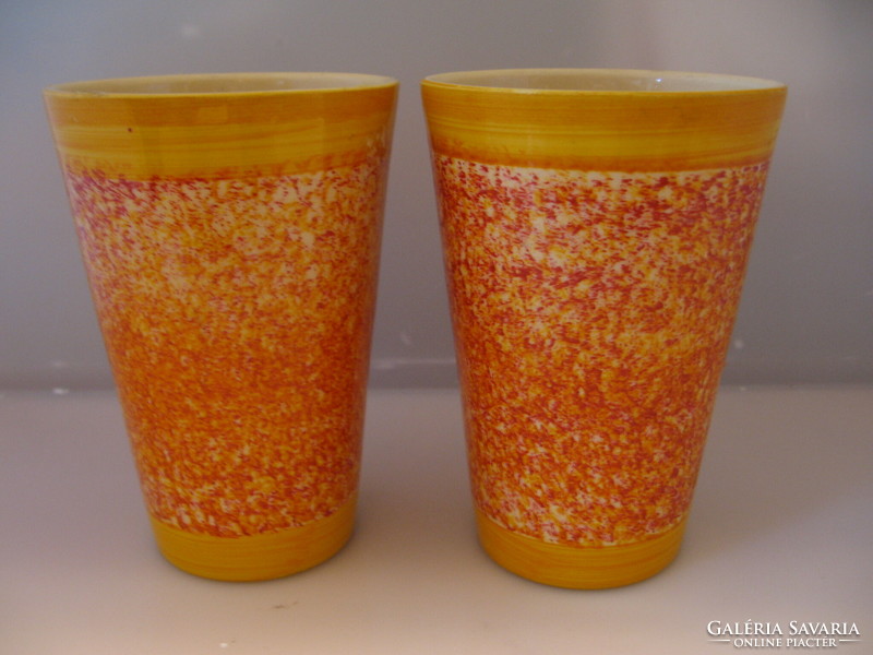 A pair of orange ceramic bowls