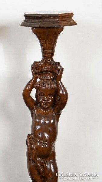 Carved wooden pedestal with figural decor