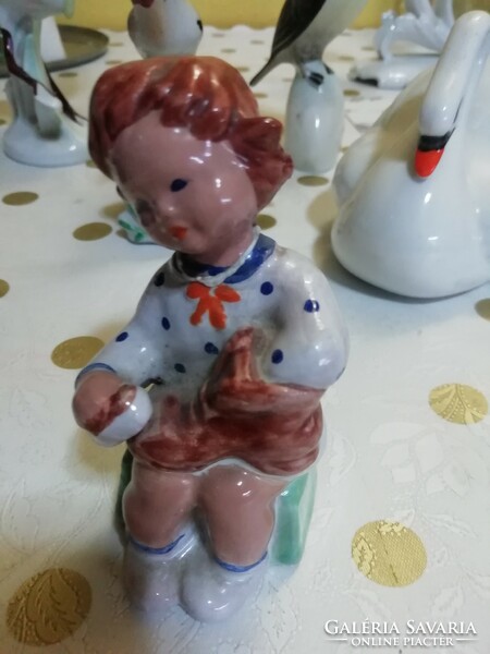 Old ceramic little girl in perfect condition