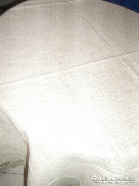 Beautiful and elegant dove gray woven tablecloth with a lace edge