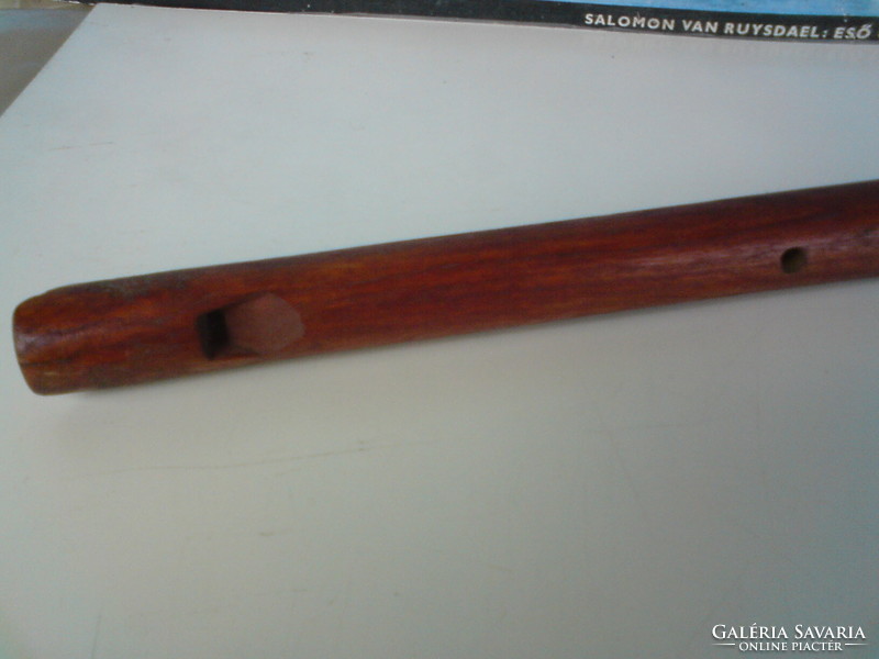 Old hand-carved toy flute
