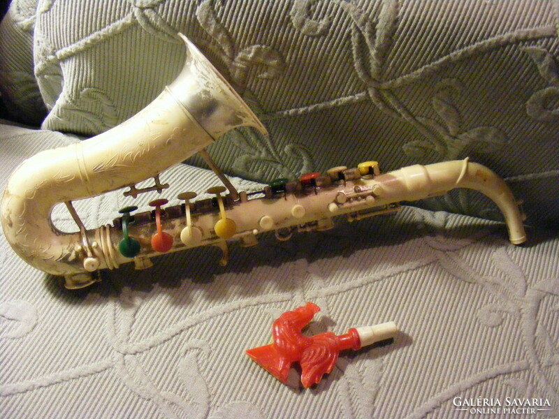 Retro Russian plastic toy saxophone and mini cocked bagpipes