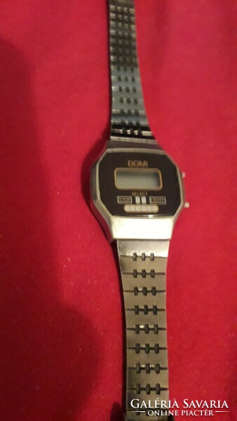 Domi quartz women's wristwatch from an old socialist era with untested steel strap as shown in the pictures