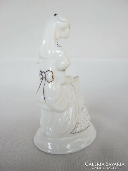 Porcelain figurine of reading girl