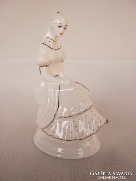 Porcelain figurine of reading girl