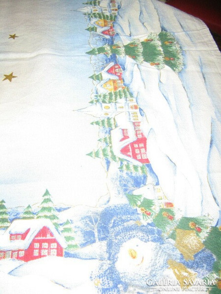 Beautiful winter tablecloth in a snowy landscape with snowy houses