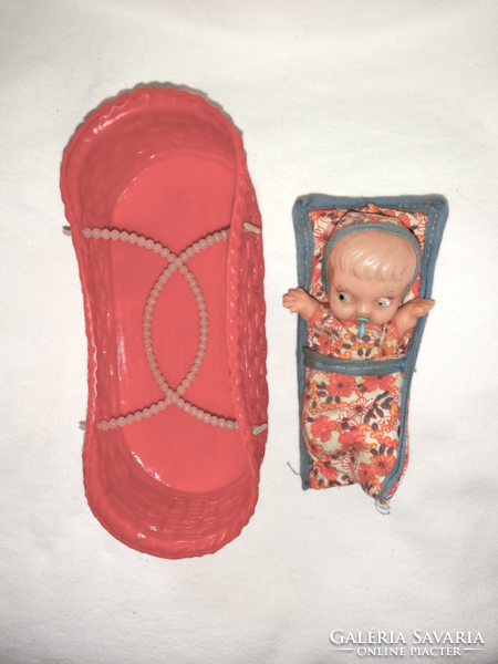 Traffic goods, plastic doll from the 60s, in a basket.