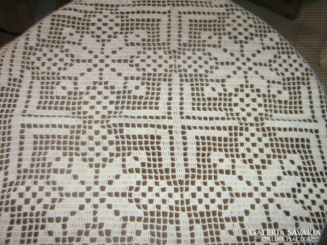 Beautiful antique hand-crocheted white tablecloth with a special pattern