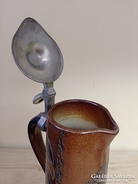 Salt-glazed pitcher with glasses