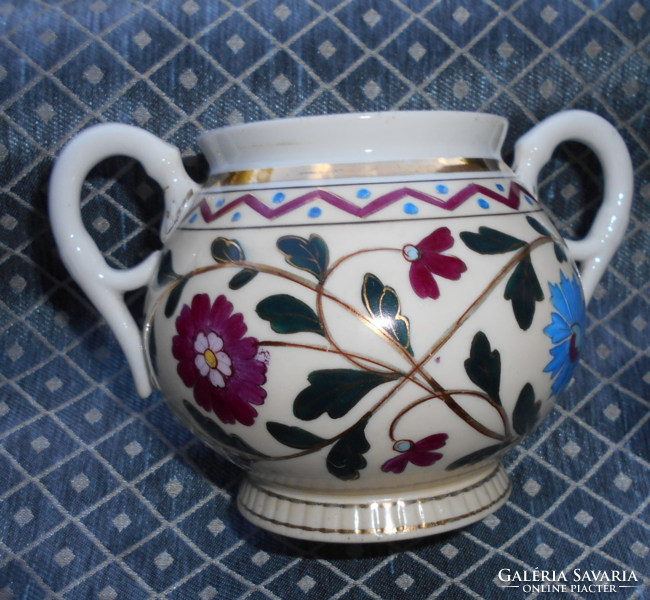 Antique hand-painted bowl with golden contour