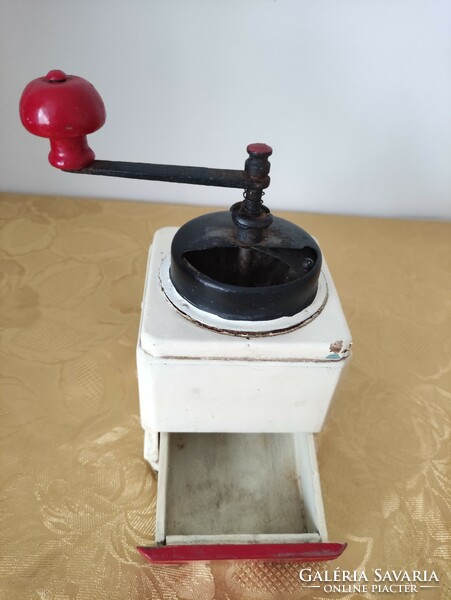 Old manual coffee grinder with drawers