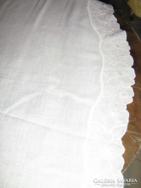 Dreamy antique snow-white elegant round woven tablecloth with floral lace edges