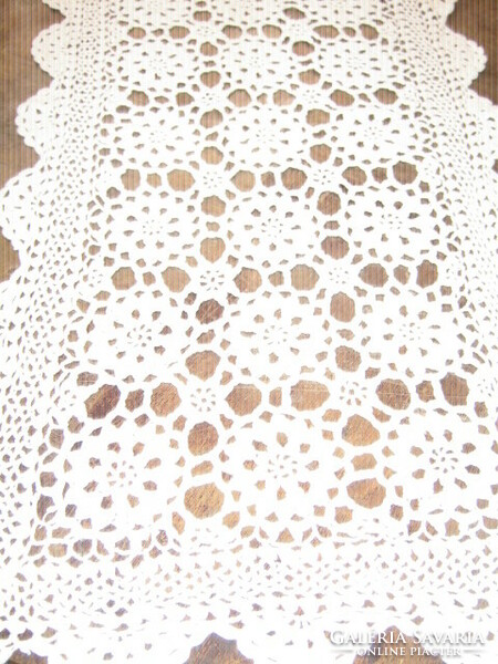 Beautiful hand-crocheted lace tablecloth with antique art nouveau features