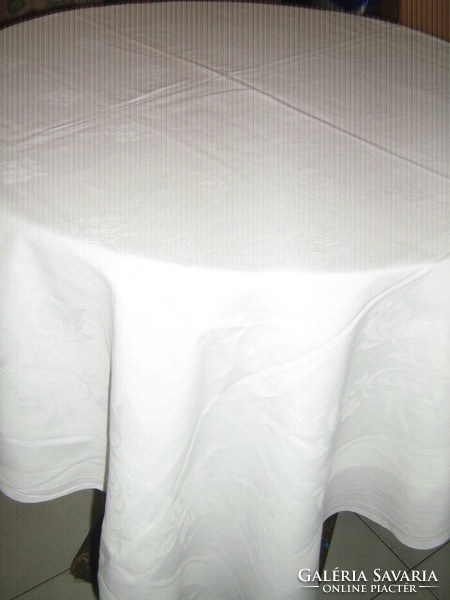 White antique damask tablecloth with a beautiful flower pattern