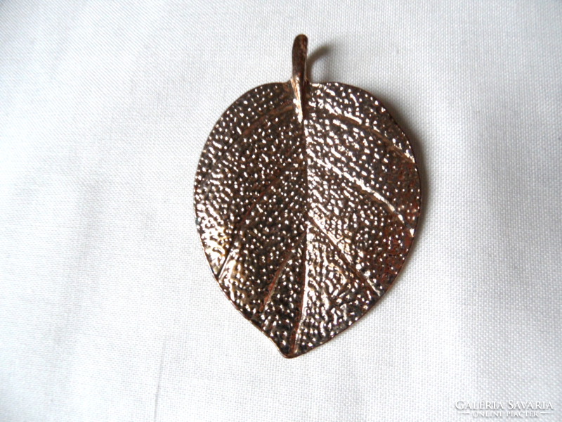 Gold colored leaf pendant