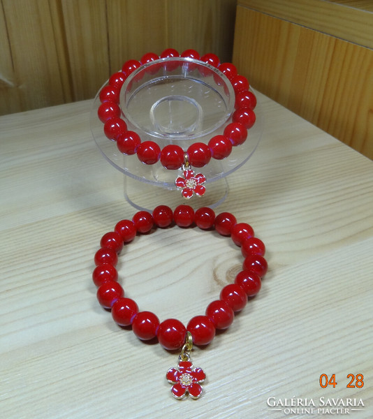 Bracelet made of beautiful red glass beads with fire enamel flower decoration