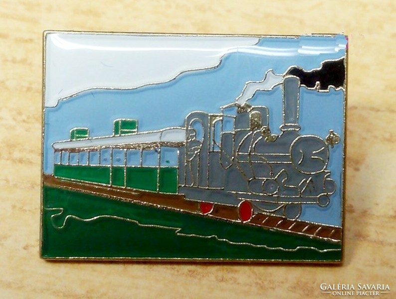 Steam express train fire enamel pin from the 1980s, in original packaging