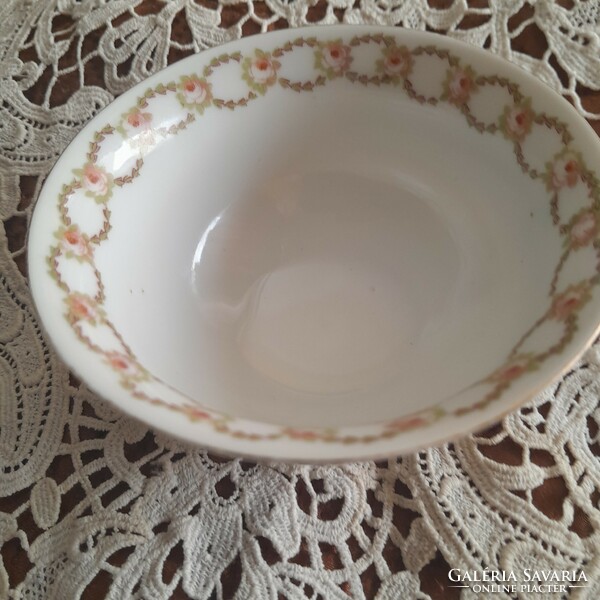 Antique teacup with garlands