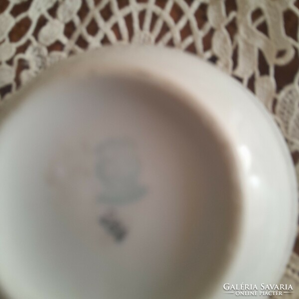 Antique teacup with garlands