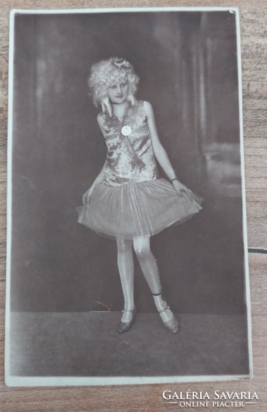 Old vintage young girl on stage or in costume ball, black and white photo postcard approx. 1920..