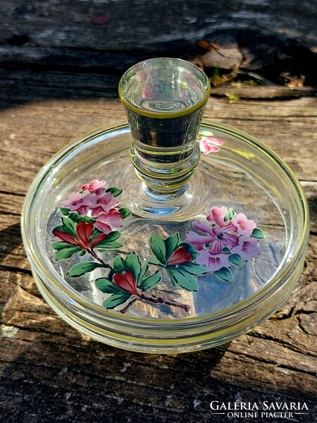 Glass bowl holding lemon rings with a painted lid.