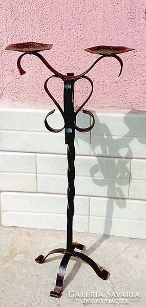 Pair of candle holders on wrought iron legs.