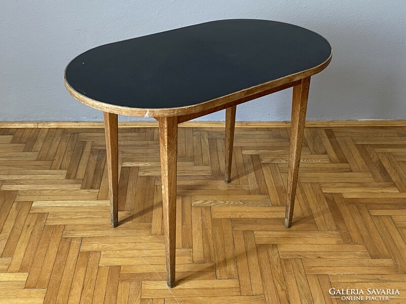 Black flat retro table with rounded ends