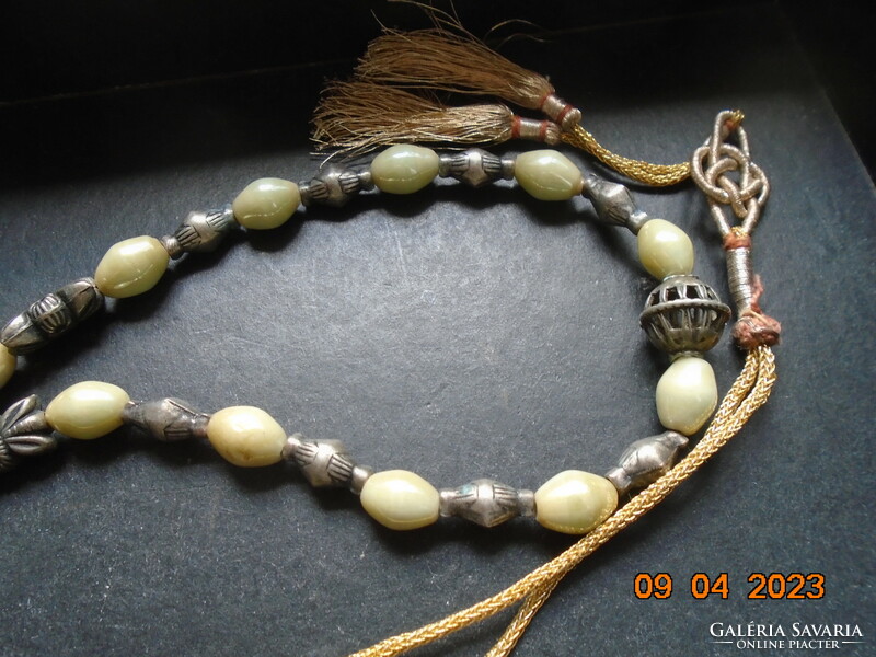 Interesting neck blue Celtic knot with gold thread cord, pale green opal glass and figurative silver beads
