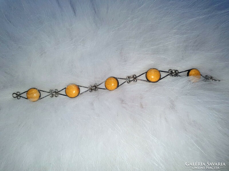 Silver bracelet with yellow stones