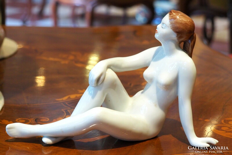 Raven House figure: nude sitting on the ground